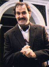 A photograph of John Cleese playing the character of Basil Fawlty, from the BBC comedy series Fawlty Towers