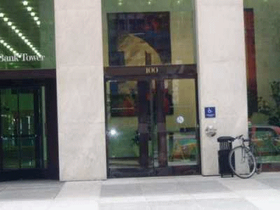 A photograph of the front door of a modern office block